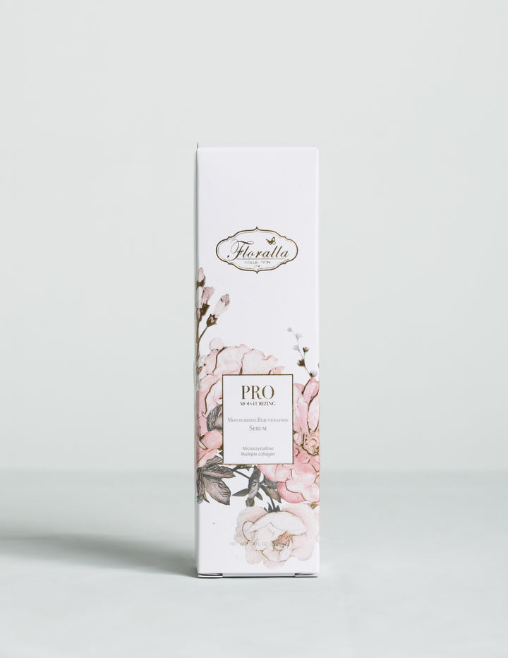 Floralla Pro Moisturizing Rejuvenation Serum, in white cardboard box with pink floral designs and gold accents.
